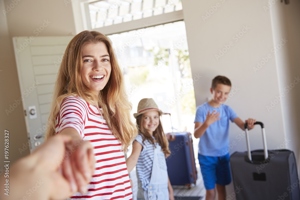POV Shot Of Family With Luggage Leaving House For Vacation