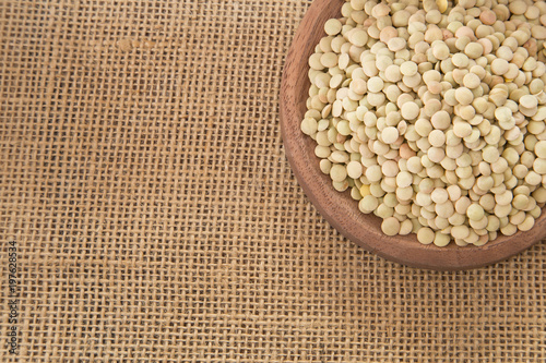 Raw lentils in the bowl - Lens culinaris