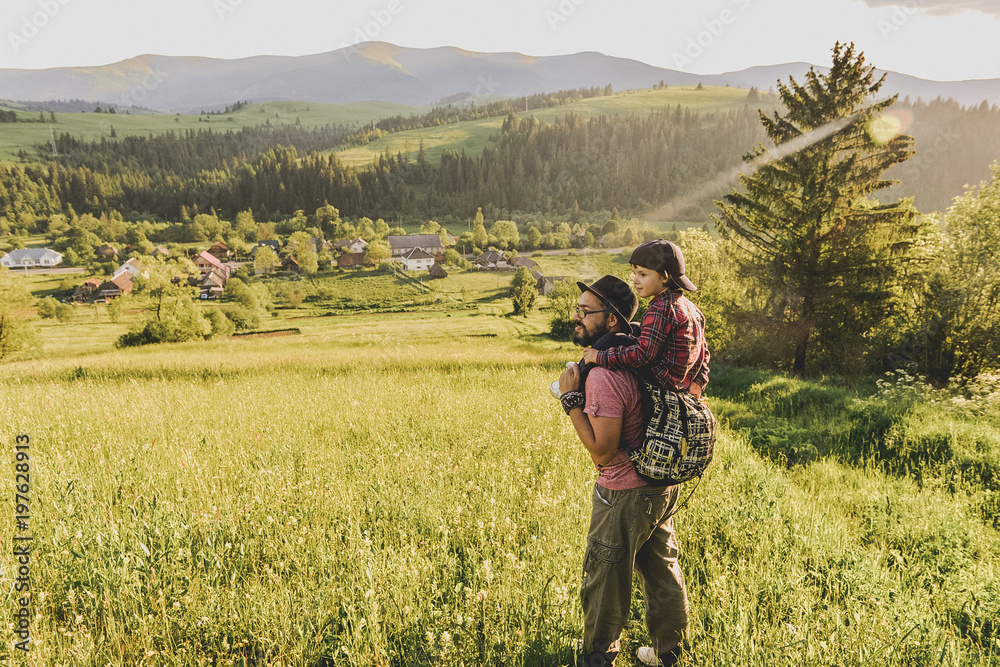 Fototapeta premium Son with father on mountain