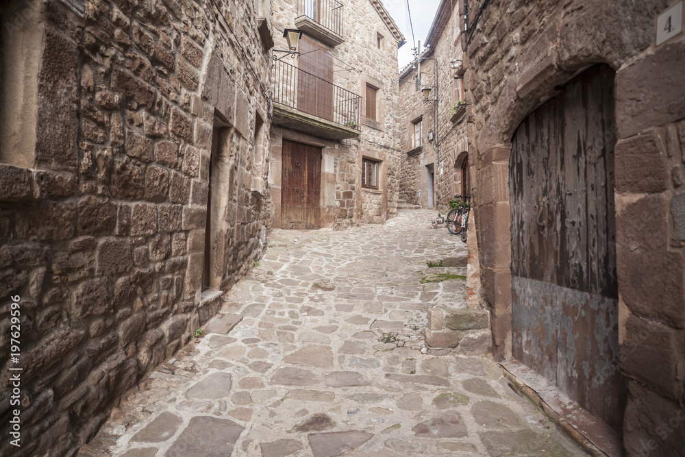 Street village, stone pavement and walls in  L Estany,moianes region comarca, province Barcelona,Catalonia.