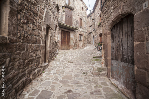 Street village, stone pavement and walls in  L Estany,moianes region comarca, province Barcelona,Catalonia. © joan_bautista