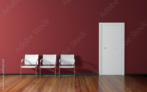 Waiting room with red wall, wooden floor and three white chairs