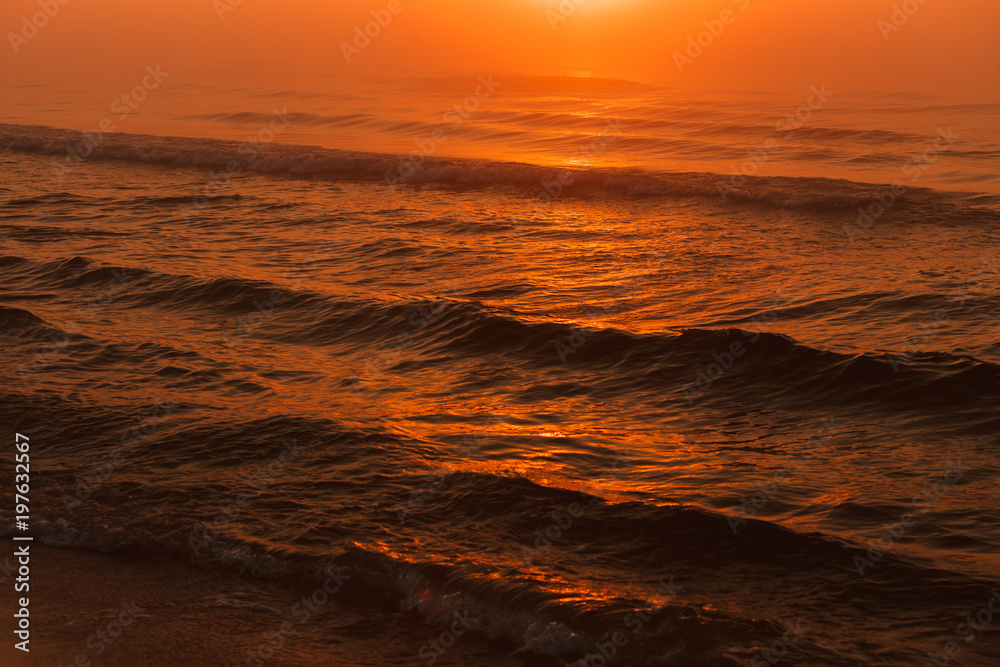 Waving sea during sunset