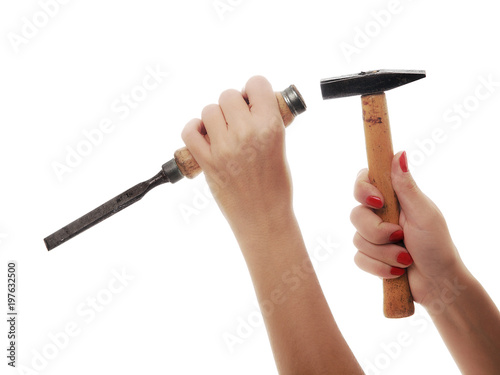 woman hand working with hammer and chisel