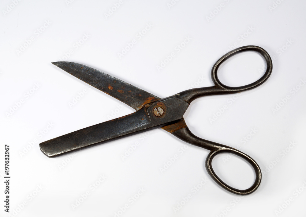 Old, medium-sized dressmaker shears on a white background. Old, medium-sized dressmaker shears on a white background.