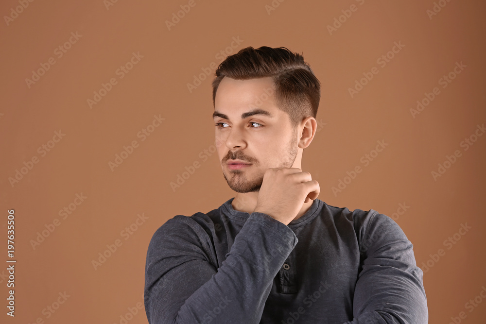 Portrait of young man with beautiful hair on color background Portrait of young man with beautiful hair on color background