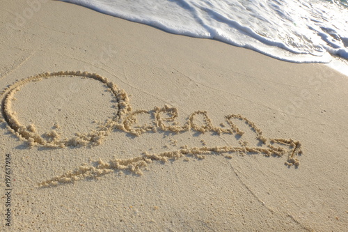 ocean ecris sur le sable