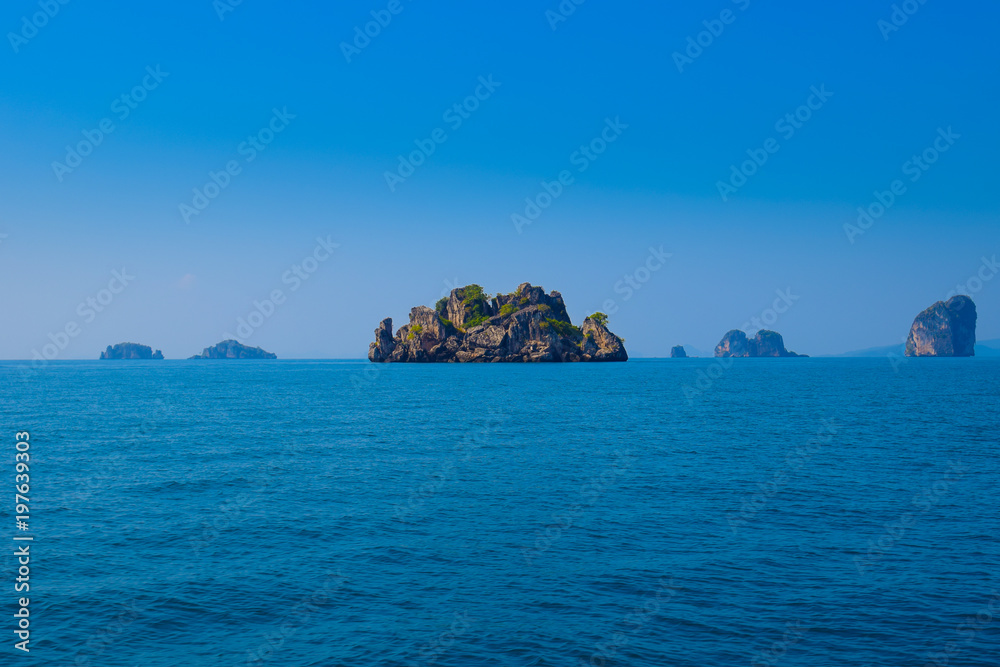 Tropical sea with island in andaman sea in Krabi during summer vacation time.