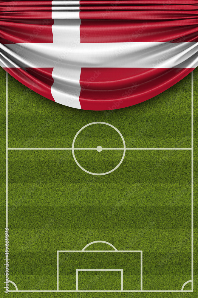 Fototapeta premium Denmark country flag draped over a football soccer pitch. 3D Rendering