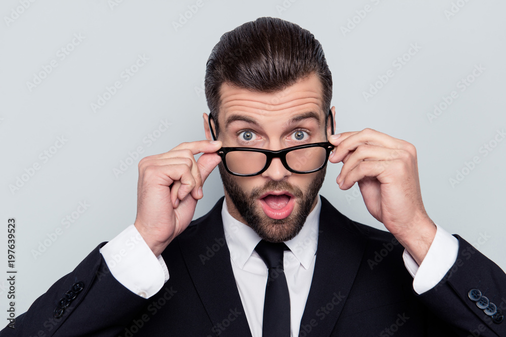 Close up portrait of handsome wondered attractive shocked amazed with big eyes mouth modern trendy stylish hairdo hairstyle taking-off glasses white shirt tie necktie boss isolated on gray background Close up portrait of handsome wondered attractive shocked amazed with big eyes mouth modern trendy stylish hairdo hairstyle taking-off glasses white shirt tie necktie boss isolated on gray background