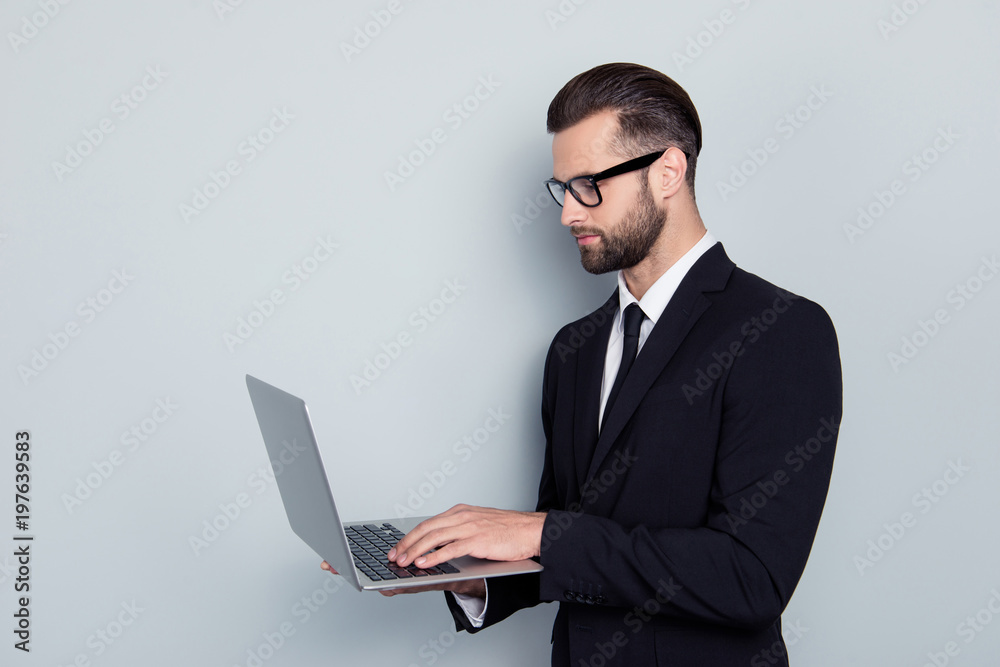 Side view portrait of smart expert clever qualified handsome stylish trendy focused concentrated confident professional successful freelancer reading using news isolated on gray background copy-space Side view portrait of smart expert clever qualified handsome stylish trendy focused concentrated confident professional successful freelancer reading using news isolated on gray background copy-space