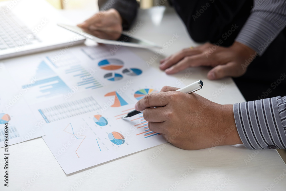 Teamwork process, Business adviser analyzing financial figures denoting the progress in the work of the company Teamwork process, Business adviser analyzing financial figures denoting the progress in the work of the company