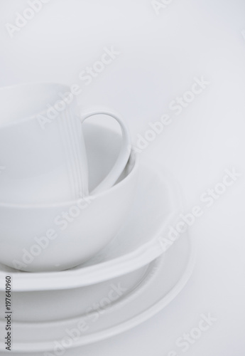 three white plates cup white background