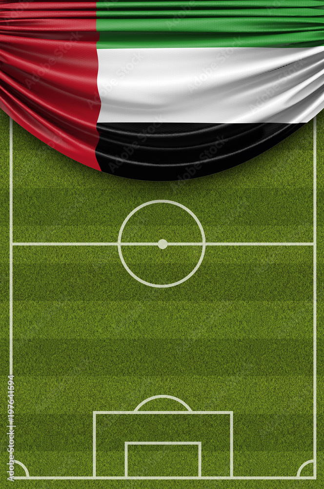 United Arab Emirates country flag draped over a football soccer pitch. 3D Rendering