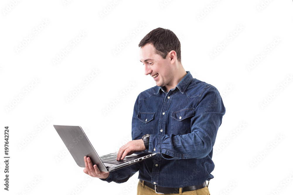 young programmer holding a laptop in hands isolated on white background. Copy space young programmer holding a laptop in hands isolated on white background. Copy space