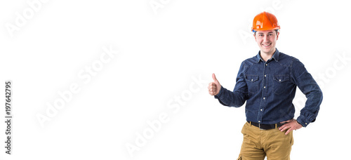 Portrait of smiling repairman (builder) in helmet gesturing okay isolated on white background. Copy space