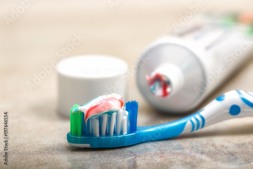 toothbrush and toothpaste on the shelf