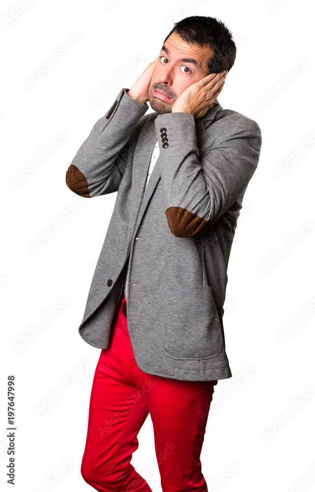 Handsome man covering his ears on isolated background Handsome man covering his ears on isolated background