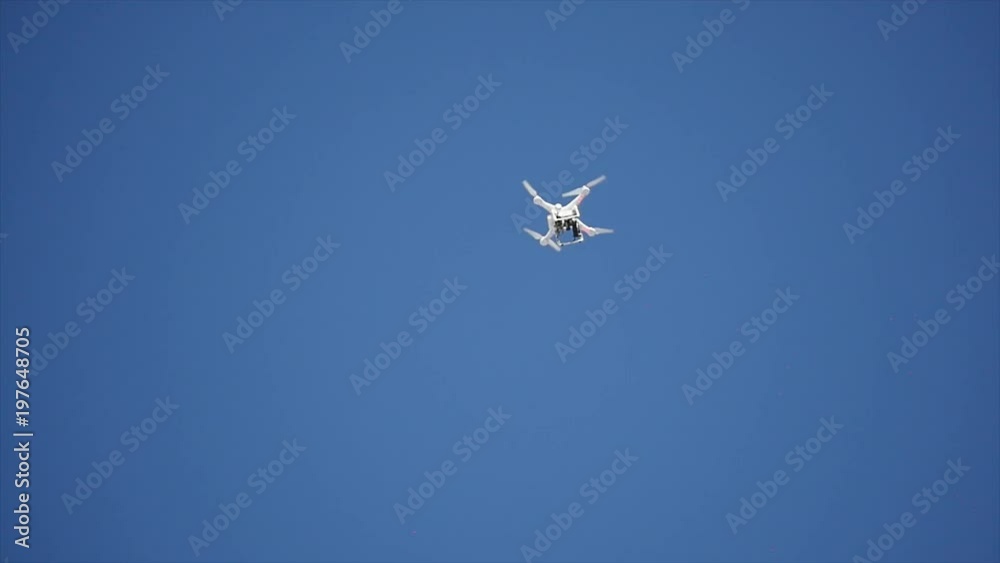 Professional Camera Drone flying in clear blue Sky Professional Camera Drone flying in clear blue Sky