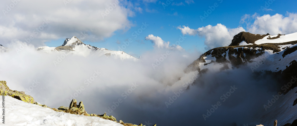 High mountains landscape with clouds.