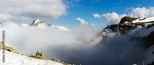 High mountains landscape with clouds.