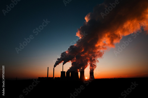 coal fired power station silhouette at sunset, Pocerady, Czech republic photo