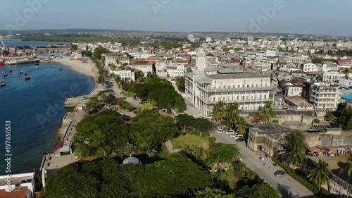 AERIAL view of the Stone Town, old part of Zanzibar City. Flight above main city of Zanzibar, Tanzania, Africa, Indian Ocean, 4k UHD photo