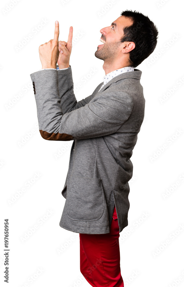Handsome man pointing up on isolated background Handsome man pointing up on isolated background