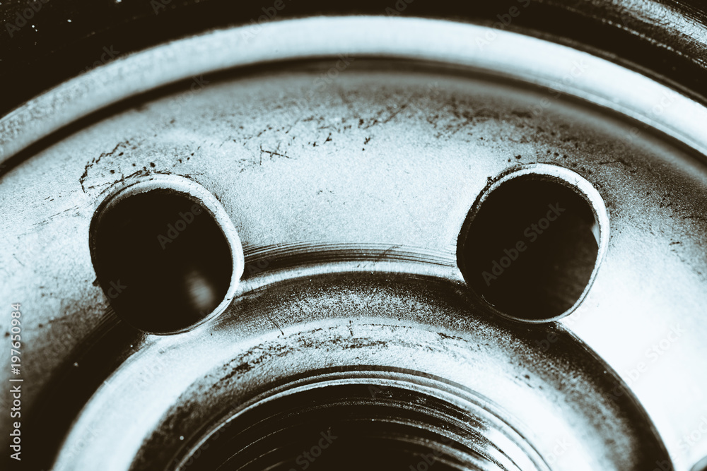 Monochrome background image of oil filter close up. Art macro photography of auto part.