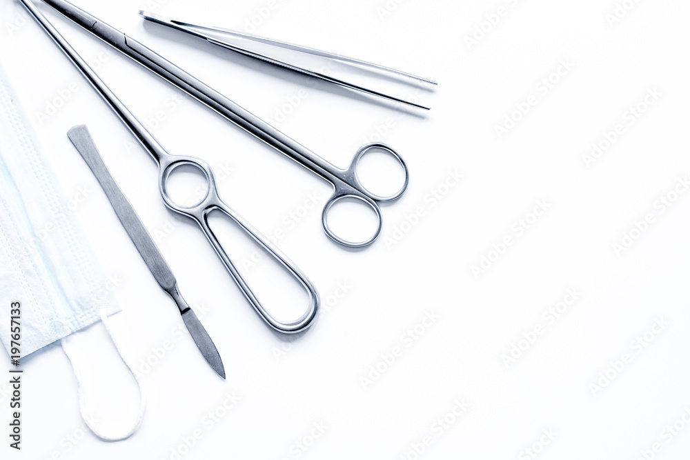 instruments for plastic surgery on white background top view instruments for plastic surgery on white background top view