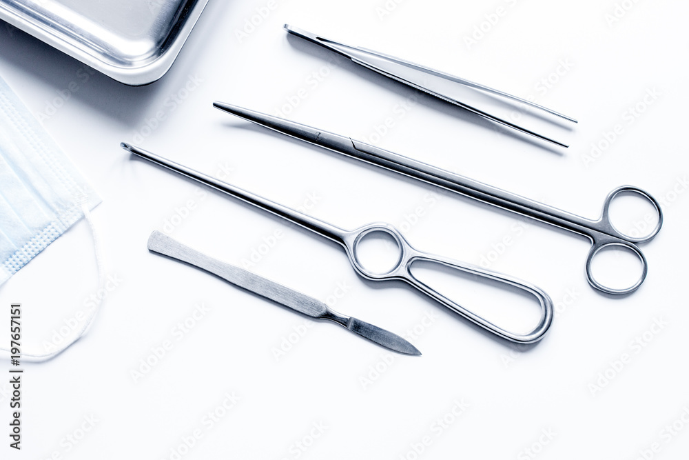 instruments for plastic surgery on white background top view instruments for plastic surgery on white background top view