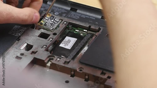 Small screw removed from back of laptop