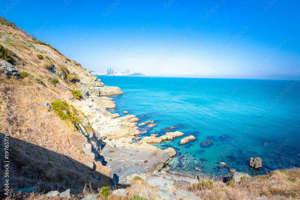 View of Igidae park coastline and Haeundae district from Oryukdo Skywalk in sunny day, Busan, Korea