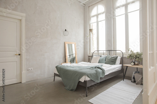 Interior bedroom of white and gray cozy bed