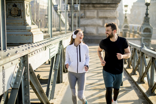 Couple jogging on Chain Bridge in Budapest