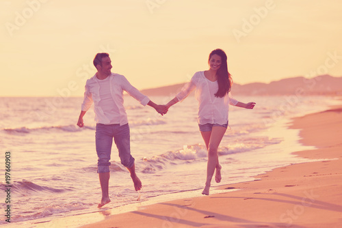 young couple on beach have fun