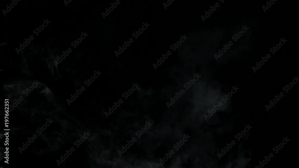 White Smoke floats over black background White Smoke floats over black background