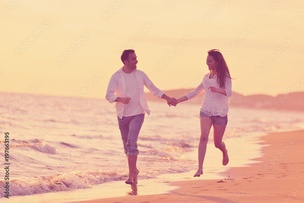 young couple  on beach have fun