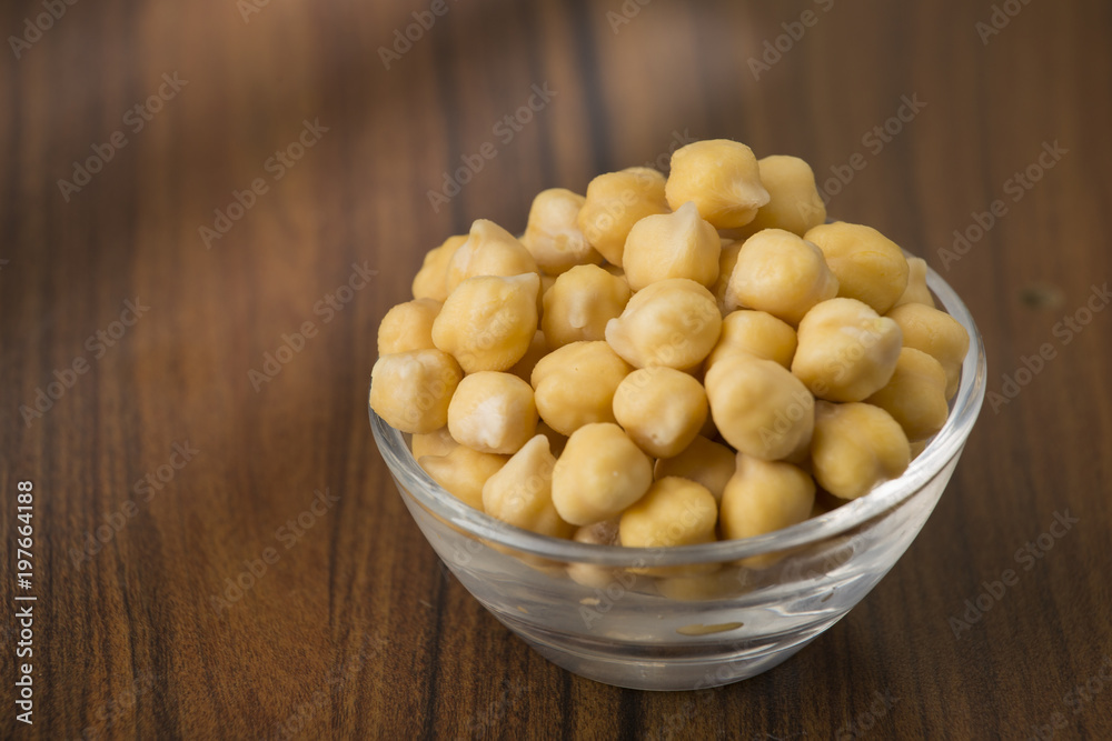 grains of chickpeas, (Cicer arietinum) in bowl on the table grains of chickpeas, (Cicer arietinum) in bowl on the table