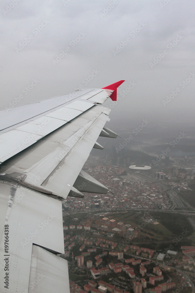 Wing of plane and city under pouring rain. Istanbul, Turkey Wing of plane and city under pouring rain. Istanbul, Turkey