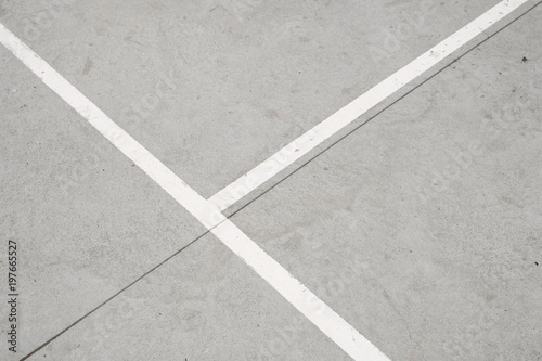 Fototapeta Naklejka Na Ścianę i Meble -  sport field lines closeup - white lines on concrete floor