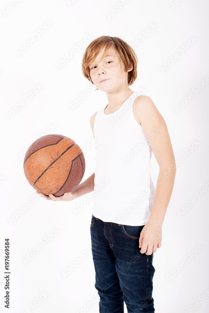 young blond boy holding a basketball young blond boy holding a basketball
