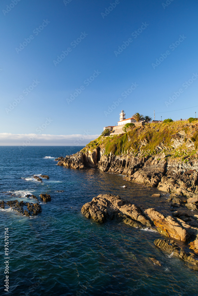 Lighthouse on the coast in Cudillero, Spain