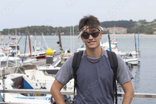 smiling young woman on a vacation day in a marina, Cantabria, Spain © bsanchez