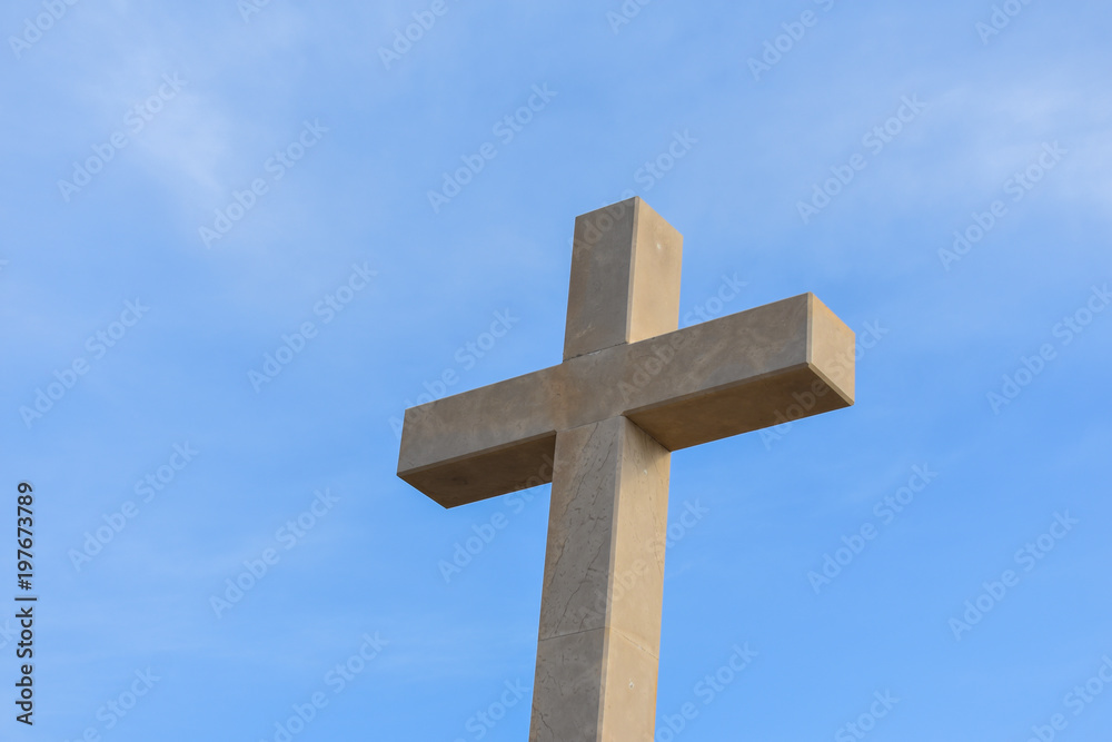 Catholic cross on the hills in Dubrovnik Croatia. Catholic symbol against blue sky 