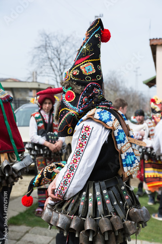 People in traditional carnival masquerade costumes at Kukeri Festival, Medovo village near Burgas, Bulgaria