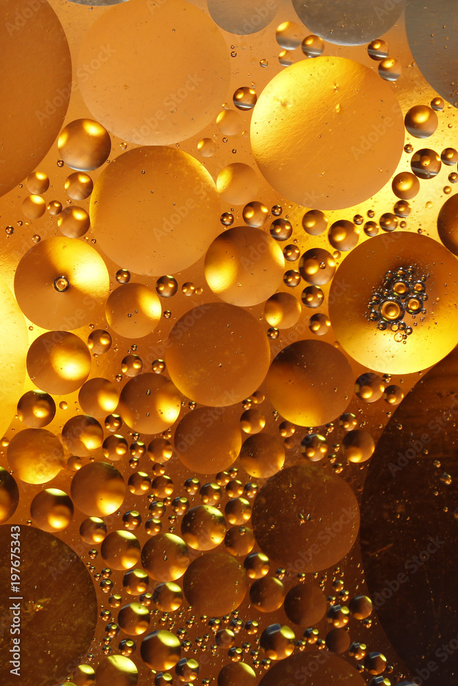 Wallpaper. Fantastic landscape. Drops of oil on the water. Abstract shapes of colored circles on a colorful background.
