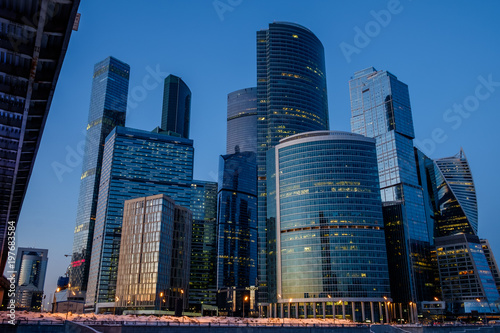 Skyscrapers in Moscow, a frozen river, a bridge, an evening landscape
