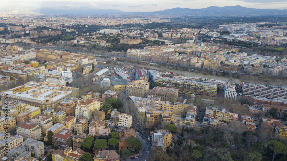 Panoramic aerial view of the northern area of Rome, Italy, on a sunny day. You can see a part of the river Tiber and in the background the city. Panoramic aerial view of the northern area of Rome, Italy, on a sunny day. You can see a part of the river Tiber and in the background the city.