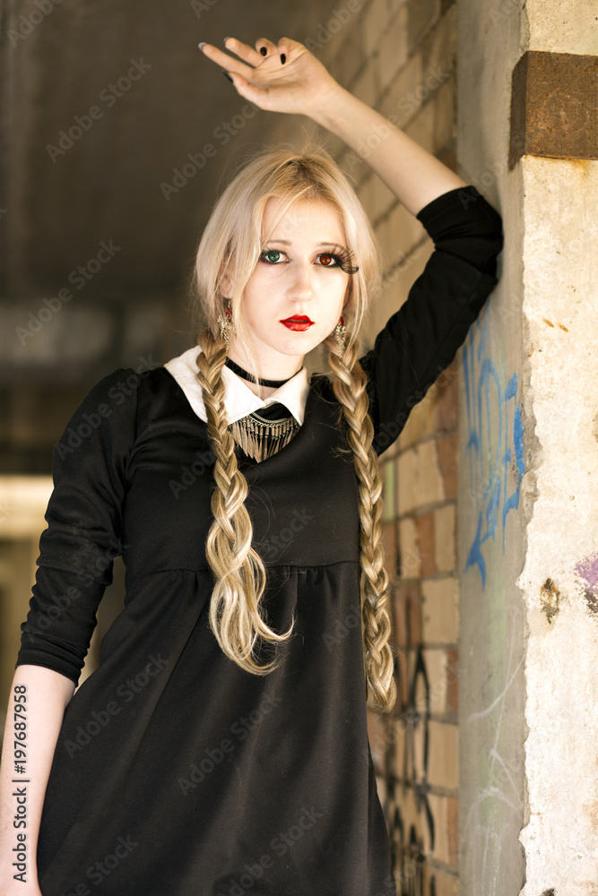 Blonde gothic girl posing in the abandoned ruined house building фотография  Stock | Adobe Stock
